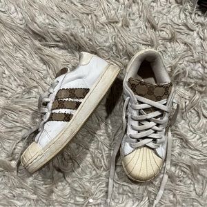 Addidas superstars with Gucci print